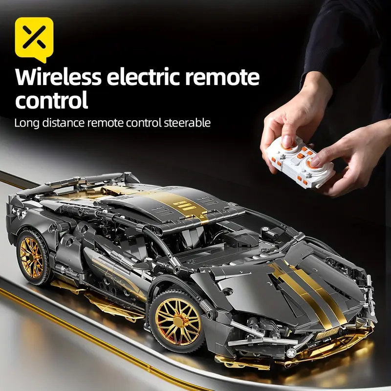 Black and gold remote control car with detailed construction and handheld remote.