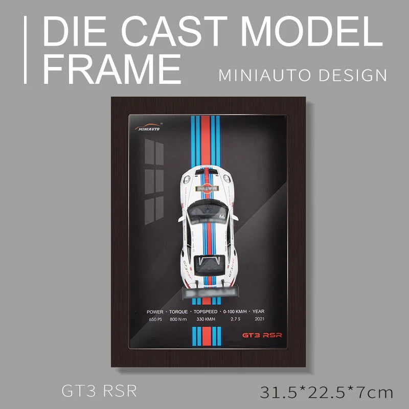 Framed MiniAuto Design Die Cast Model of a White GT3 RSR with Blue and Red Stripes. Dimensions: 31.5 x 22.5 x 7cm