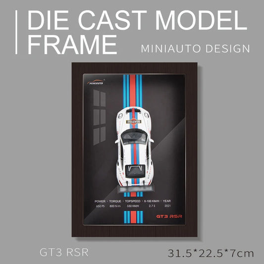 Framed MiniAuto Design Die Cast Model of a White GT3 RSR with Blue and Red Stripes. Dimensions: 31.5 x 22.5 x 7cm
