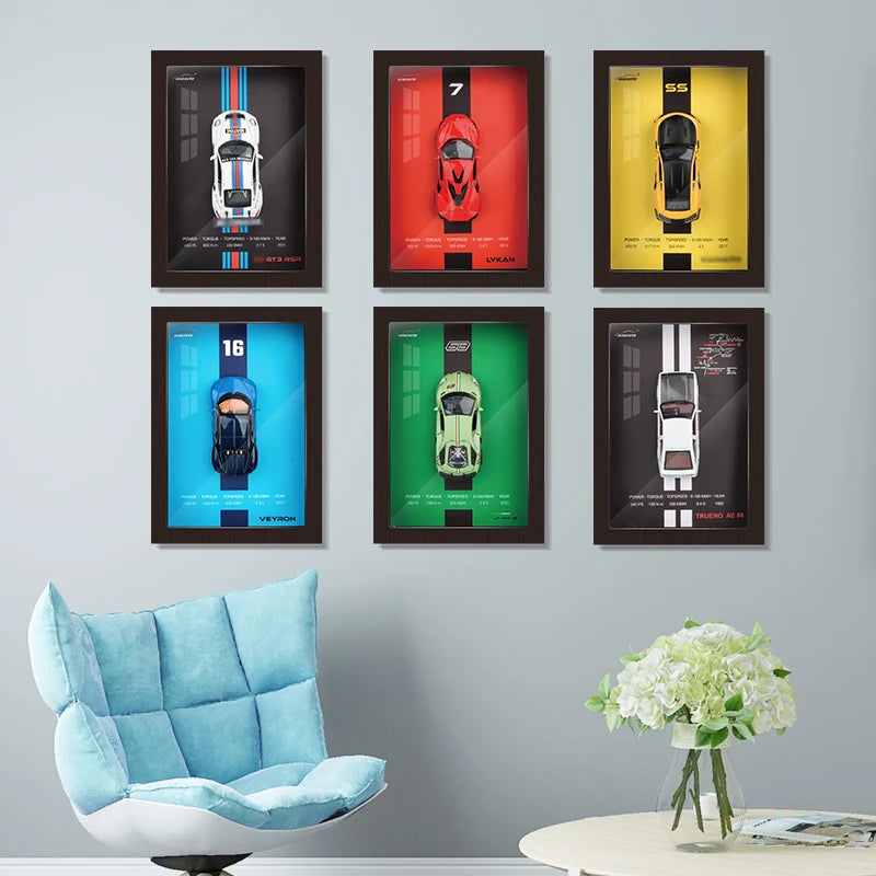 Framed car art prints featuring top-down views of sports cars in various colors.