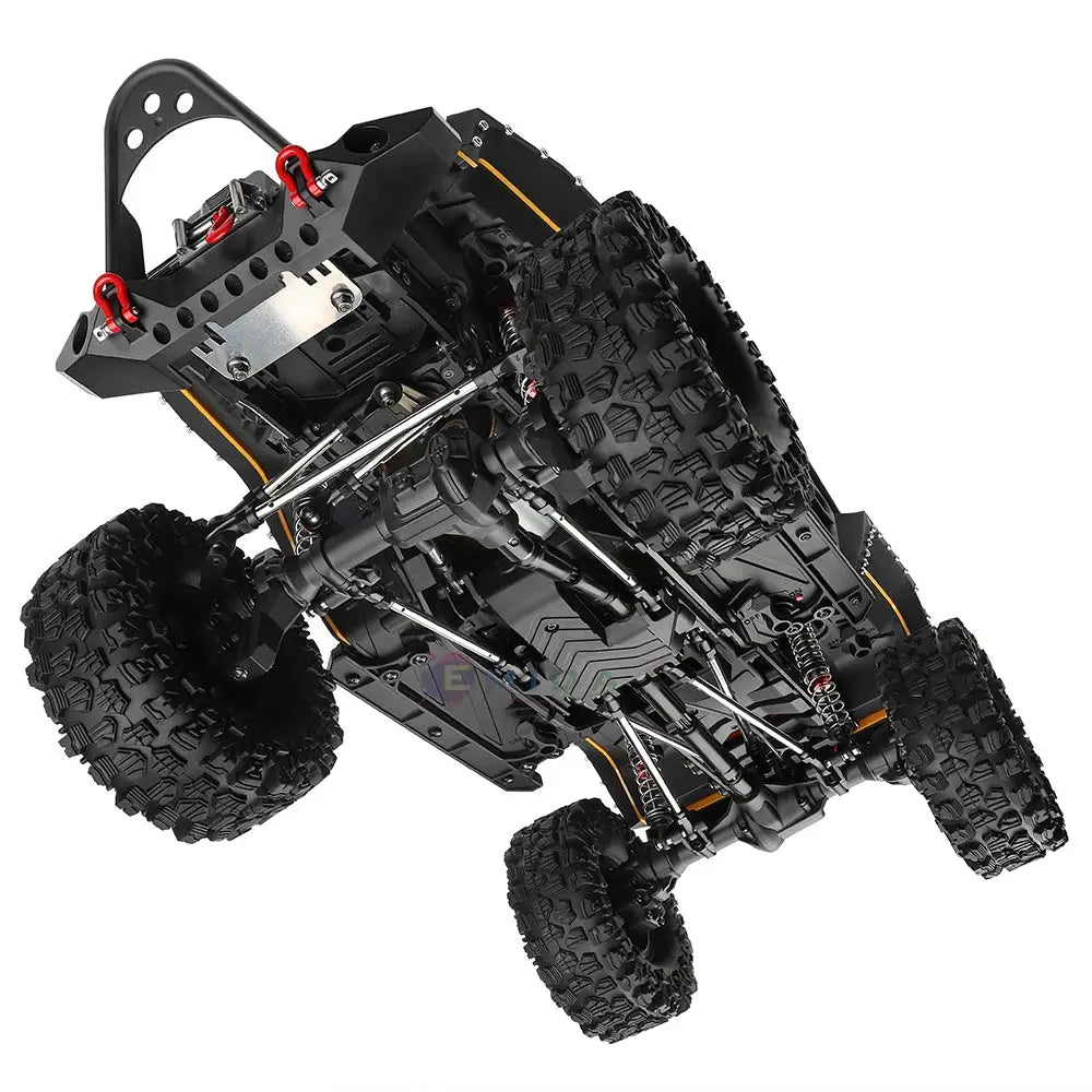 Underside view of a black RC rock crawler showcasing its chassis, suspension, and oversized tires.
