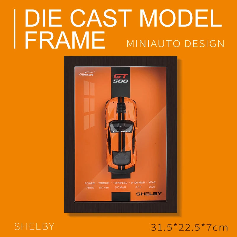 Framed orange Shelby GT500 die-cast model car, MiniAuto design, showing top view and stats.