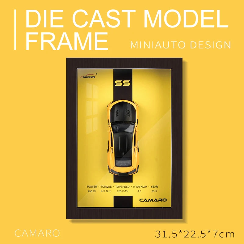 Framed die-cast 2017 Camaro SS model car with yellow background and performance specs.