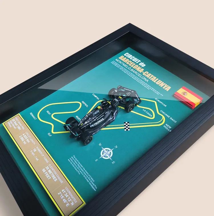 Framed Circuit de Barcelona-Catalunya poster with a model Formula 1 car and Spanish flag.