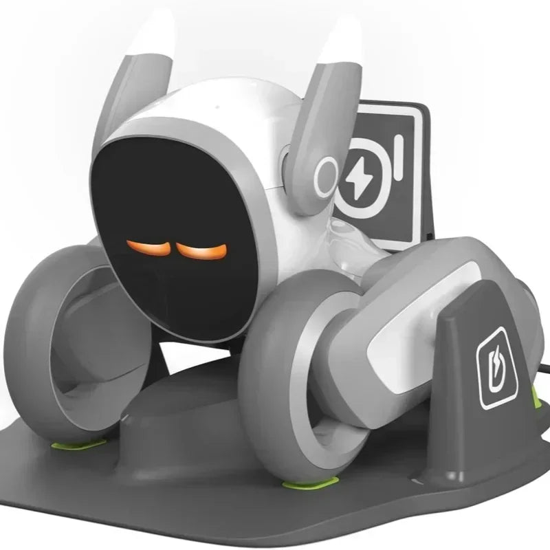 Gray and white wheeled robot toy on charging base with screen eyes.